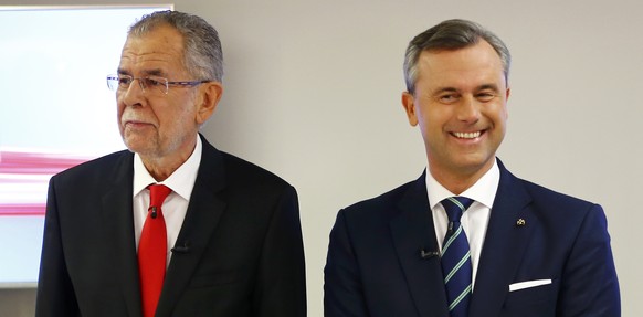Austrian presidential candidate Alexander Van der Bellen (L), who is supported by the Greens, and Norbert Hofer of the FPOe pose for photographers before a TV discussion in Vienna, Austria, December 1 ...