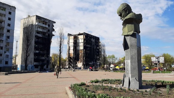 epa09913778 Visible damage to buildings partially destroyed by bombing, seen during a visit by UN Secretary General Antonio Gurterres, in Borodianka, Ukraine, 28 April 2022. UN Secretary General Anton ...