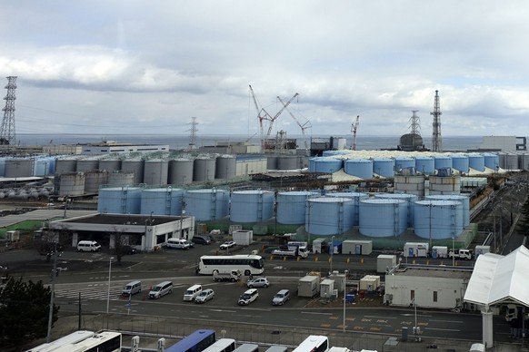 FILE - This photo shows some of about 1,000 huge tanks holding treated but still radioactive wastewater at the Fukushima Daiichi nuclear power plant, operated by Tokyo Electric Power Company Holdings  ...