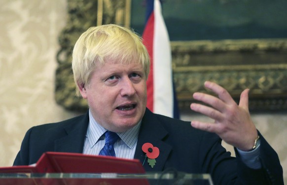 FILE - In this file photo dated Friday, Oct. 27 2017, Britain&#039;s Foreign Secretary Boris Johnson gestures during a joint news conference with Portuguese Foreign Minister Augusto Santos Silva follo ...