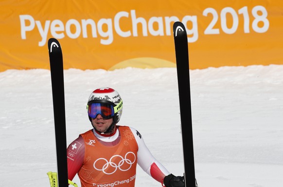 Switzerland&#039;s Beat聽Feuz pauses after finishing men&#039;s downhill training at the 2018 Winter Olympics in Jeongseon, South Korea, Friday, Feb. 9, 2018. (AP Photo/Christophe Ena)