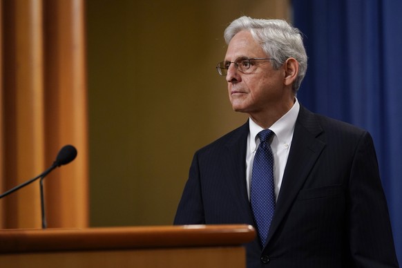 FILE - Attorney General Merrick Garland listens to a question as he leaves the podium after speaking at the Justice Department, Aug. 11, 2022, in Washington. Garland is moving to end sentencing dispar ...