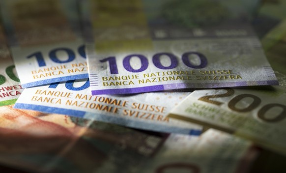 Detail view of the nineth Swiss banknote series: ten, twenty and fifty, hundred, two hundred and thousand Swiss franc note, photographed on November 7, 2019. (KEYSTONE/Gaetan Bally)

Detailansicht der ...