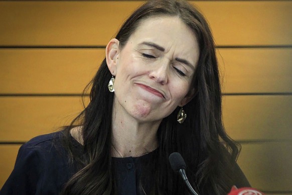 New Zealand Prime Minister Jacinda Ardern grimaces as she announces her resignation at a press conference in Napier, New Zealand. Fighting back tears, Ardern told reporters that Feb. 7 will be her las ...