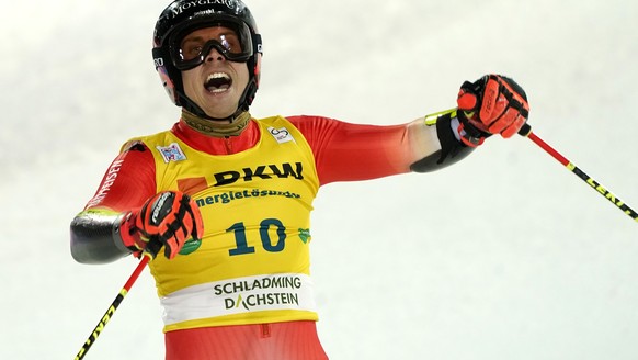 Switzerland&#039;s Gino Caviezel, second placed, celebrates in the finish area of an alpine ski, men&#039;s World Cup giant slalom in Schladming, Austria, Wednesday, Jan. 25, 2023. (AP Photo/Giovanni  ...