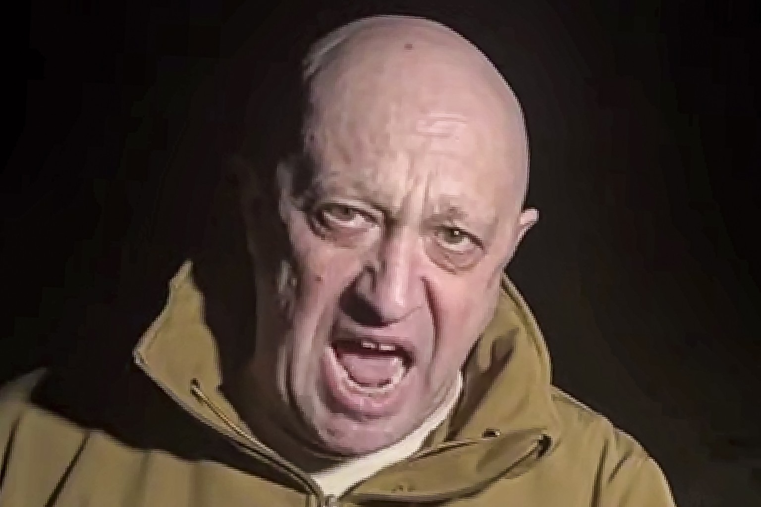 FILE - In this handout image taken from a video released by Prigozhin Press Service on Friday, May 5, 2023, head of Wagner Group Yevgeny Prigozhin stands in front of multiple bodies lying on the groun ...