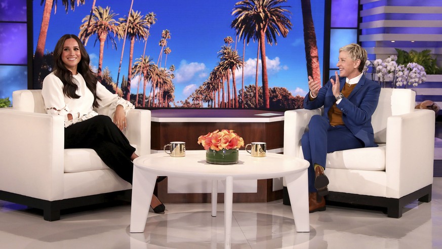 In this photo released by Warner Bros., talk show host Ellen DeGeneres, right, appears with Meghan, The Duchess of Sussex, during a taping of &quot;The Ellen DeGeneres Show&quot; at the Warner Bros. l ...