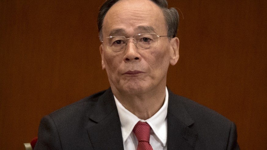 Politburo Standing Committee member Wang Qishan attends the opening session of China&#039;s 19th Party Congress at the Great Hall of the People in Beijing, Wednesday, Oct. 18, 2017. Chinese President  ...