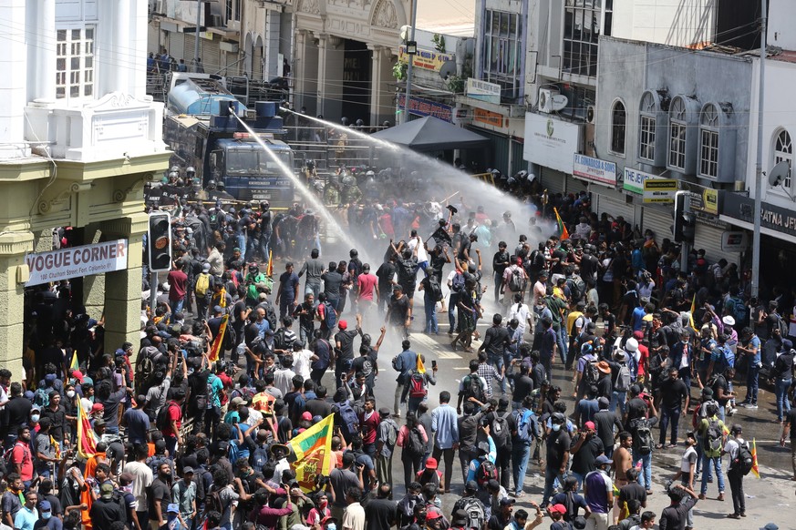 epaselect epa10061020 Security forces use water cannons to disperse an anti government protest rally, calling for the resignation of the president over the alleged failure to address the economic cris ...