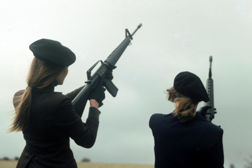 IRA girls with M16 rifles pose during a training and propaganda exercise in Northern Ireland, 12th February 1977. (Photo by Alex Bowie/Getty Images)