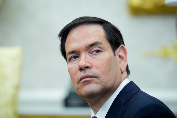 epa12253691 U.S. Secretary of State Marco Rubio looks on during a meeting between the US president and the Philippine president in the Oval Office at the White House in Washington, DC., USA, 22 July 2 ...