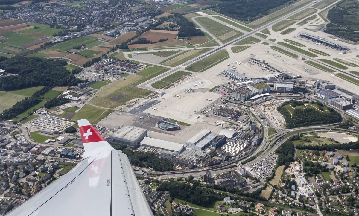 epa05411198 Aerial view from the new Bombardier C-Series CS100 airplane of the airline SWISS on the occasion of the aircraft's baptism, over the Zurich Airport, in Kloten, Switzerland, 06 July 20 ...