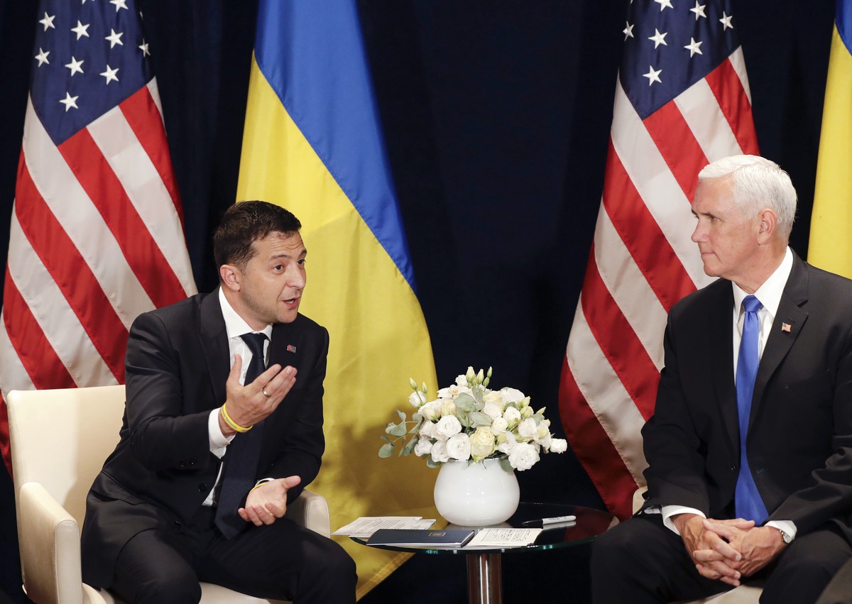 Ukraine's President Volodymyr Zelenskiy, left, gestures next to U.S. Vice President Mike Pence, during a bilateral meeting in Warsaw, Poland, Sunday, Sept. 1, 2019. (AP Photo/Petr David Josek)