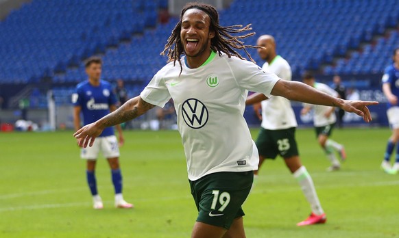 epa08498053 Kevin Mbabu (C) of VfL Wolfsburg celebrates after scoring during the German Bundesliga soccer match between FC Schalke 04 and VfL Wolfsburg at Veltins-Arena in Gelsenkirchen, Germany, 20 J ...