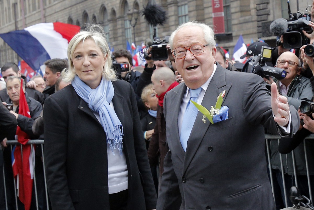 FILE - France's far-right National Front party leader Marine Le Pen, left, and her father Jean Marie pose for photographers during the traditional May Day demonstration in Paris, Wednesday, May 1 ...