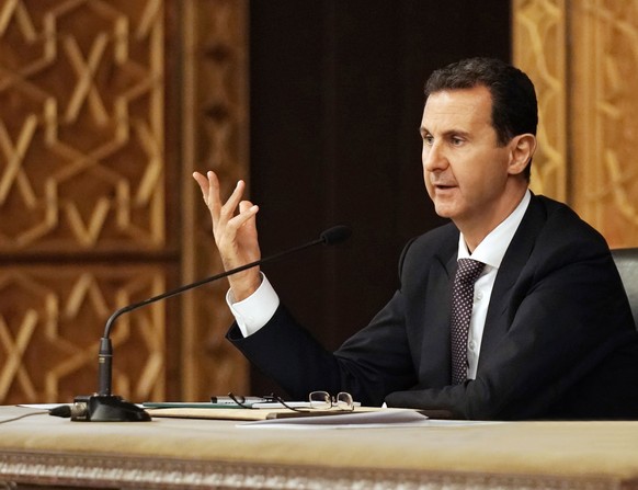 epa07077198 A handout photo made available by Syrian Arab News Agency (SANA) shows Syrian President Bashar Assad chairing a meeting of the Central Committee of al-Baath Arab Socialist Party in Damascu ...