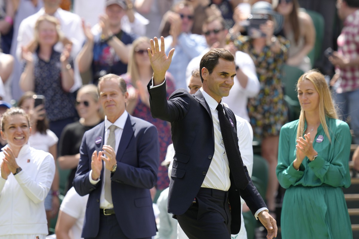 FILE - Switzerland's Roger Federer waves during a 100 years of Centre Court celebration on day seven of the Wimbledon tennis championships in London, on July 3, 2022. Federer announced Thursday,  ...