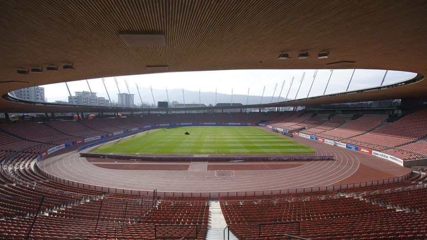 Georg Nafzger, the head greenkeeper, systematically rides the turf riding mower on the pitch of the football and track and fields stadium Letzigrund in Zurich, Switzerland, pictured on February 22, 20 ...