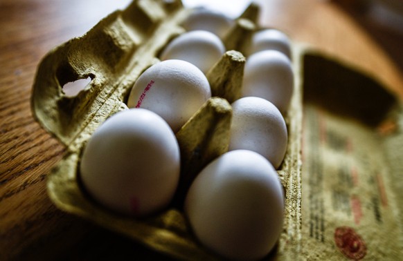 epa06124360 Eggs are place in a crate in Dresden, Germany, 04 August 2017. Aldi reported on 04 August 2017 that it was removing all eggs from it&#039;s store shelves across Germany, as a precaution ov ...