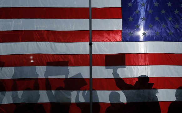 FILE - In this Jan. 26, 2020, file photo, people cheer as democratic presidential candidate Sen. Bernie Sanders, I-Vt., speaks at a campaign rally in Sioux City, Iowa. Iowa&#039;s Democrats will arriv ...