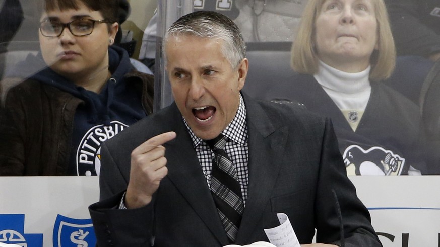 Calgary Flames head coach Bob Hartley gives instructions during the third period of an NHL hockey game against the Pittsburgh Penguins in Pittsburgh, Saturday, March 5, 2016. The Flames won 4-2. (AP P ...