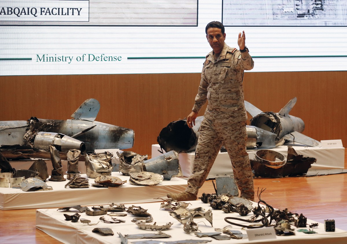 Saudi military spokesman Col. Turki al-Malki displays what he describes as an Iranian cruise missile and drones used in an attack this weekend that targeted the heart of Saudi Arabia's oil indust ...