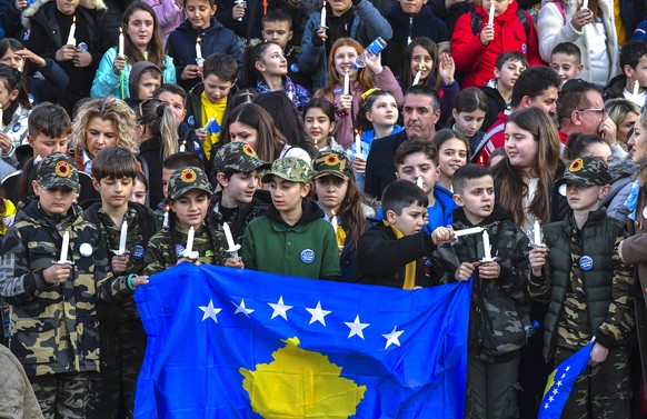 epa10473230 Children light 1133 candles in memory of the children who died during the war in Kosovo, on the occasion of Kosovo's 15th anniversary of independence in Pristina, Kosovo, February 17, 202 ...