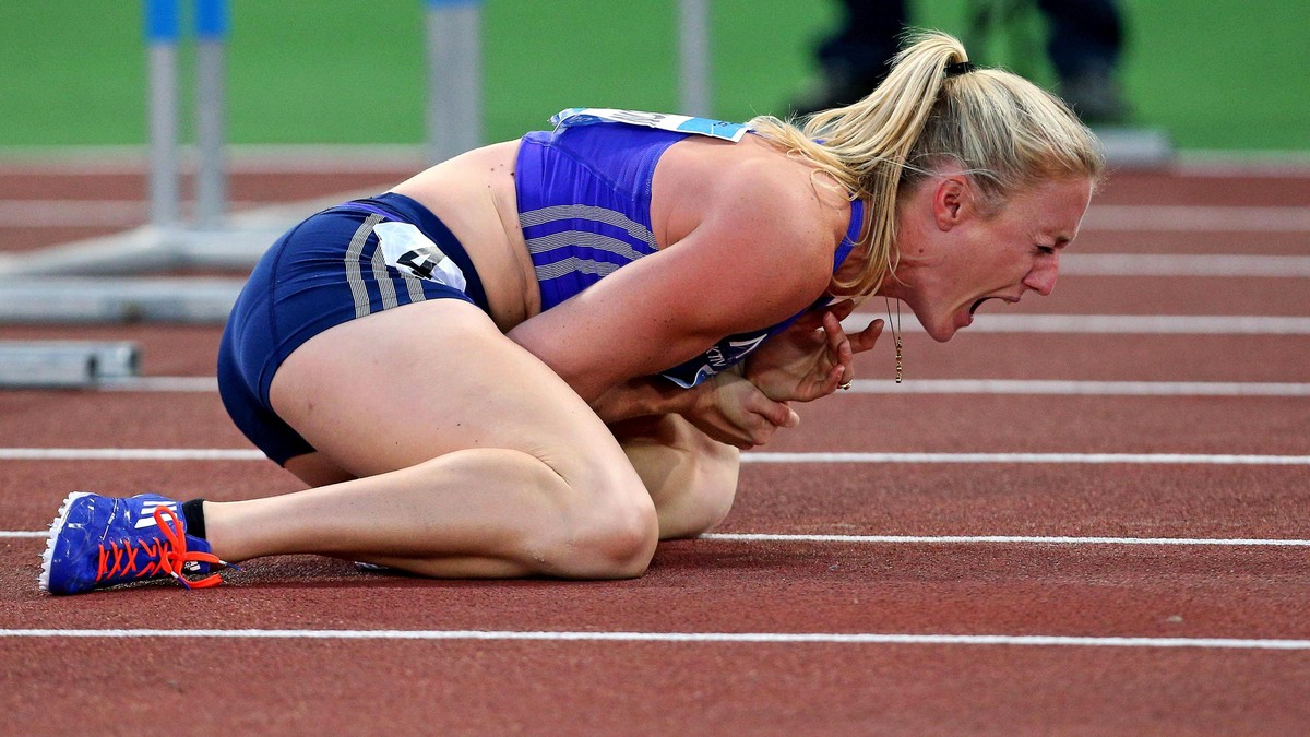 Sally Pearson shouts in pain after hitting an obstacle during the women's 100 hurdles event, at the Golden Gala IAAF athletic meeting, in Rome's Olympic stadium, Thursday, June 4, 2015. Olym ...