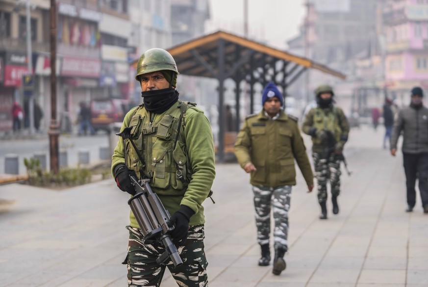 Indian paramilitary soldiers patrol at the main market in Srinagar, Indian controlled Kashmir, Monday, Dec. 11, 2023. India?s top court on Monday upheld a 2019 decision by Prime Minister Narendra Modi ...