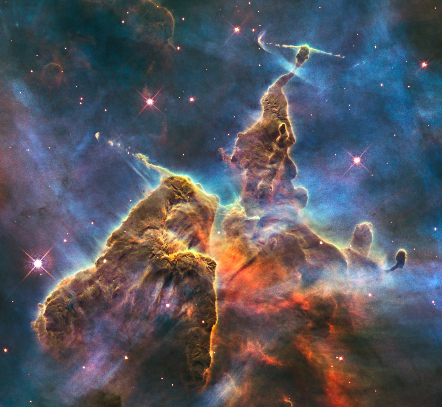 This craggy fantasy mountaintop enshrouded by wispy clouds looks like a bizarre landscape from Tolkien’s The Lord of the Rings. The NASA/ESA Hubble Space Telescope image, which is even more dramatic t ...