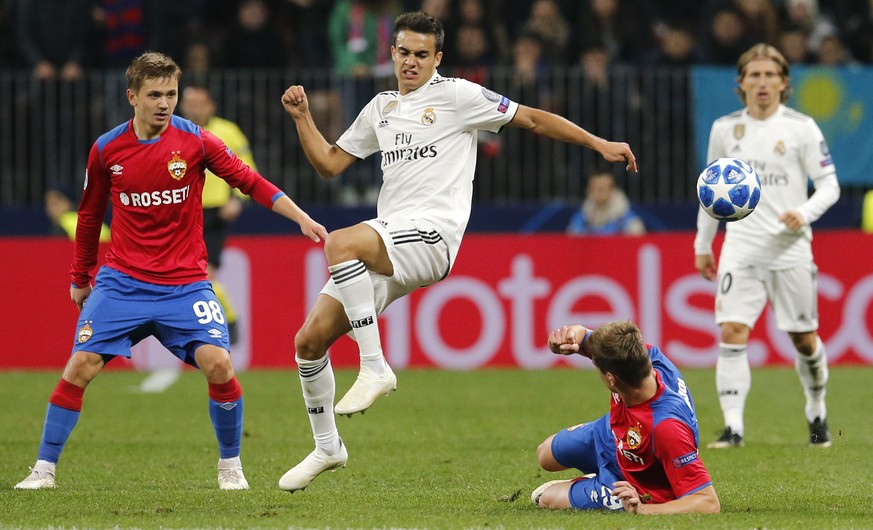 Real defender Sergio Reguilon, second left, challenge for the ball with CSKA midfielder Jaka Bijol, bottom, during a Group G Champions League soccer match between CSKA Moscow and Real Madrid at the Lu ...