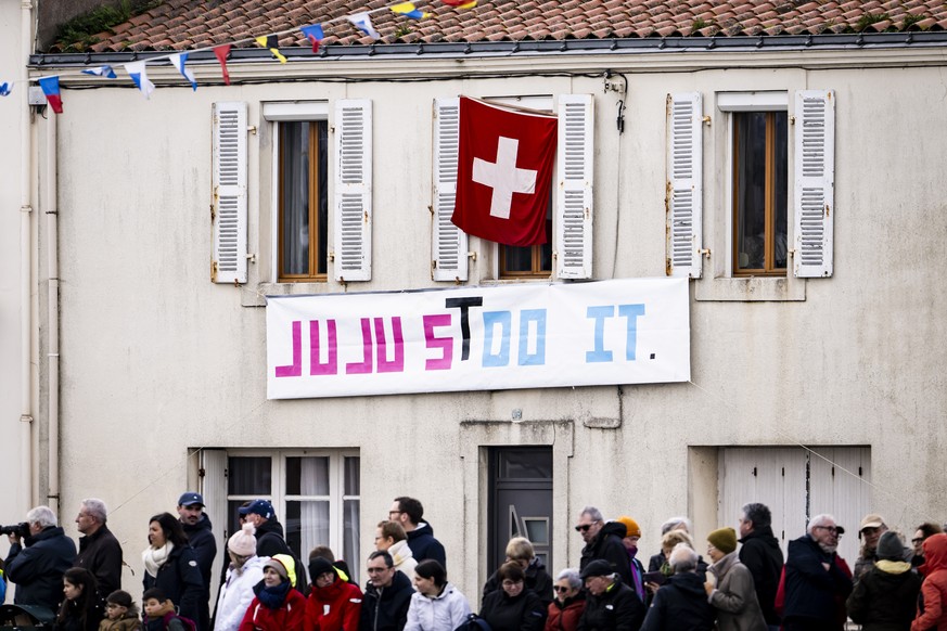 Spectators celebrate for skipper Justine Mettraux of Switzerland as she passes through the channel aboard her IMOCA Teamwork-Team Snef after crossing the finish line during the Vendee Globe round-the- ...