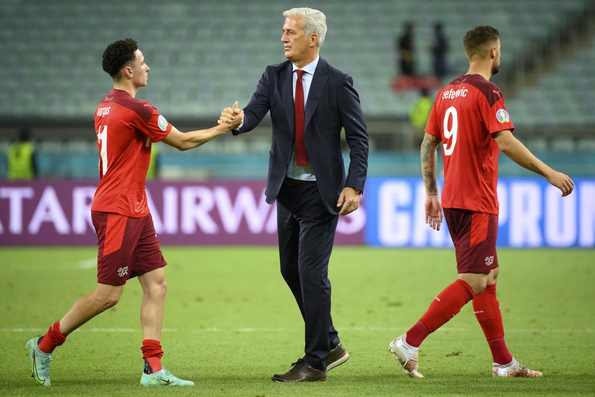 Switzerland's midfielder Ruben Vargas, left, cheers with Switzerland's head coach Vladimir Petkovic, center, in front of Switzerland's forward Haris Seferovic, right, during the Euro 20 ...