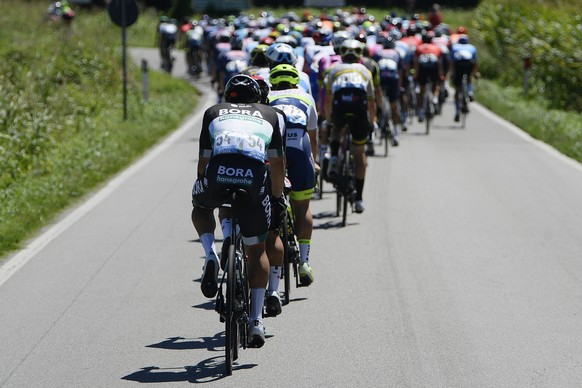 Cyclists pedal during the Milano Torino, a 198-kilometer cycling race from Milan to Turin, in Milan, Italy, Wednesday, Aug. 5, 2020. (Fabio Ferrari/LaPresse via AP)