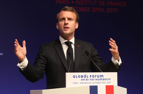 FILE - In this Oct. 30, 2019, file photo, French President Emmanuel Macron delivers a speech during the Global forum on Artificial Intelligence (AI) for Humanity (GFAIH) at the Institut de France in P ...