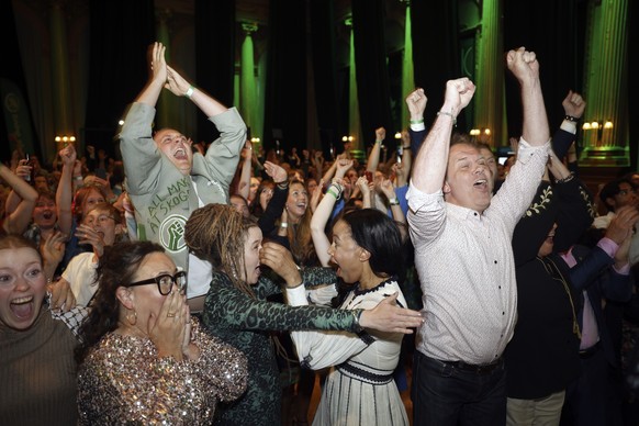 Green Party secretary Katrin Wissing, lower left wearing eyeglasses, spokeswoman Amanda Lind, center left, and top candidates Alice Bah Kuhnke, center right, and P�r Holmgren, right, celebrate with ot ...