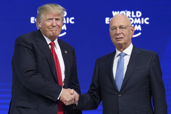 Donald Trump, President of the United States of America, left, shakes hands with German Klaus Schwab, Founder and Executive Chairman of the World Economic Forum, WEF the last day of the 48th Annual Me ...