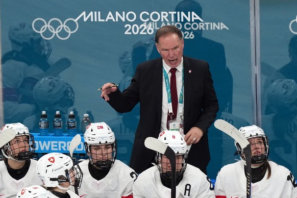 Switzerland head coach Colin Muller directs his team during the second period of a women's ice hockey semifinal match against Switzerland at the 2026 Winter Olympics, in Milan, Italy, Monday, Feb ...