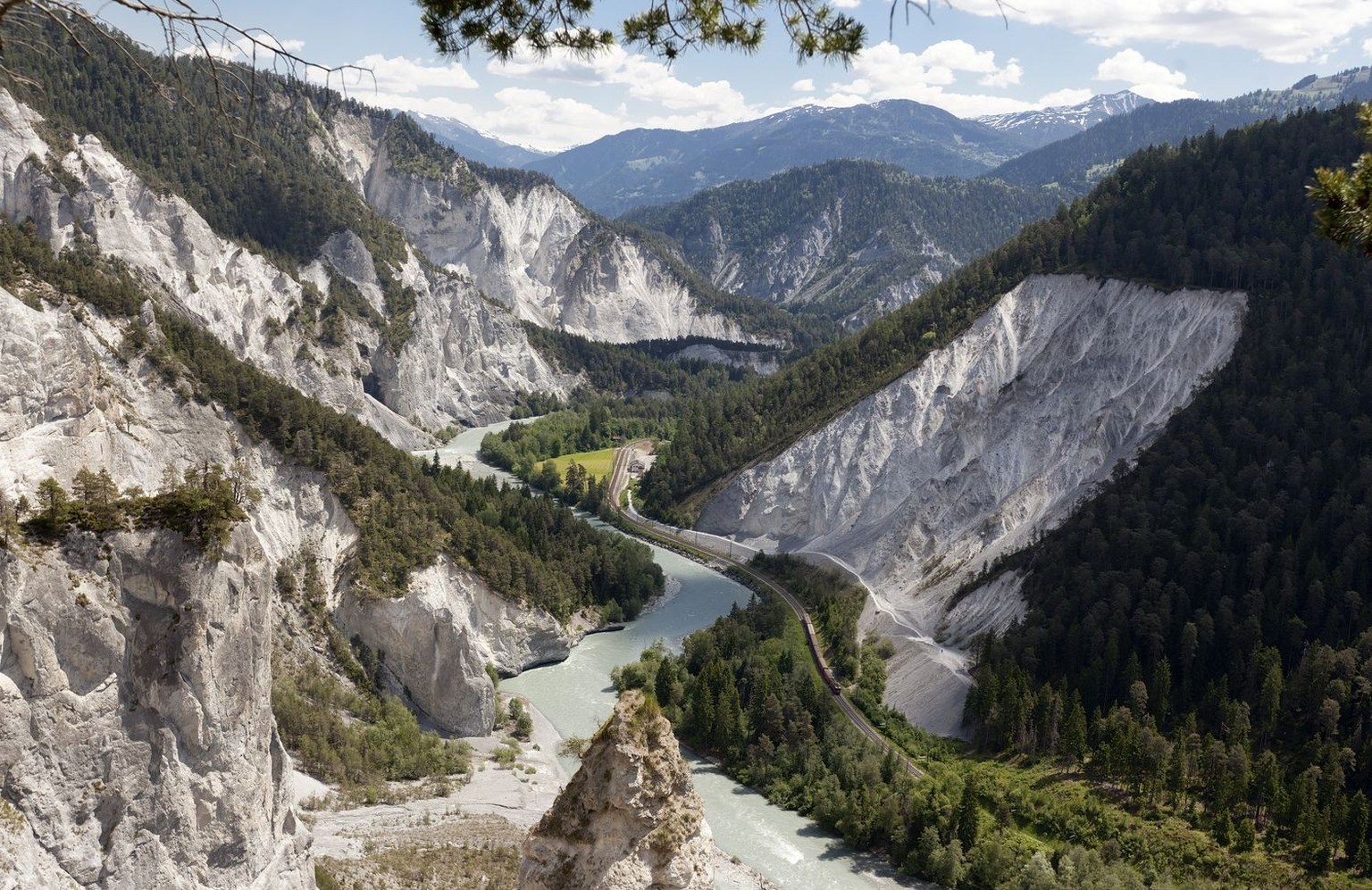 A train composition of RhB, Rhaetian Railway, passes through the Rhine Gorge on May 30, 2012, near Versam in the canton of Grisons, Switzerland. The Rhaetian Railway celebrates the 100th anniversary o ...