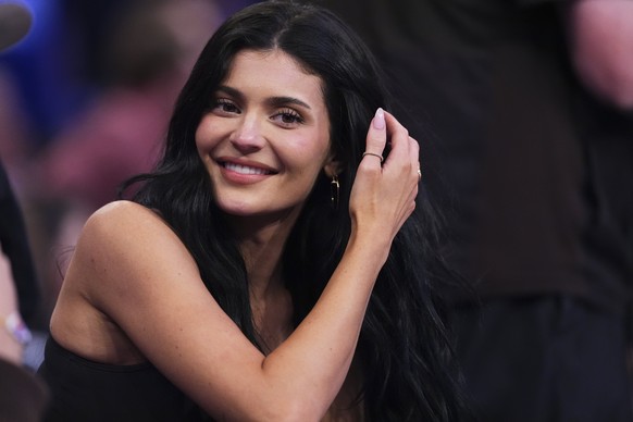 Kylie Jenner talks to colleagues during the second half of Game 4 in the Eastern Conference semifinals of the NBA basketball playoffs between the New York Knicks and the Boston Celtics Monday, May 12, ...