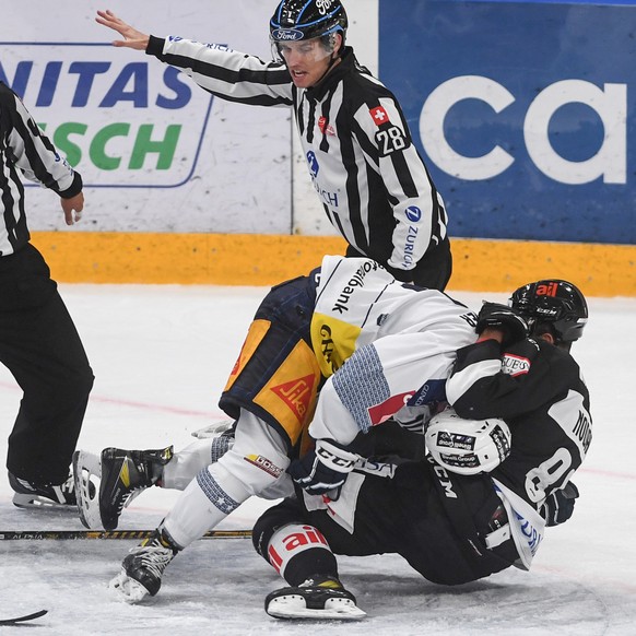 From left Zug's player Jerome Bachofner and Lugano