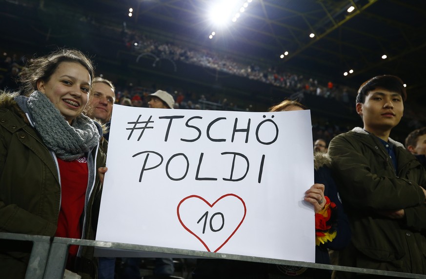 Football Soccer - Germany v England - International Friendly - Signal-Iduna-Park, Dortmund, Germany - 22/3/17 Germany fans hold up a banner for Lukas Podolski before the match Reuters / Wolfgang Ratta ...