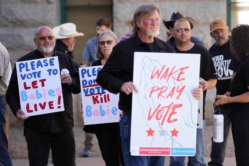 Anti-abortion supporters stand outside at the Capitol, Wednesday, May 1, 2024, in Phoenix. Democrats secured enough votes in the Arizona Senate to repeal a Civil War-era ban on abortions that the stat ...