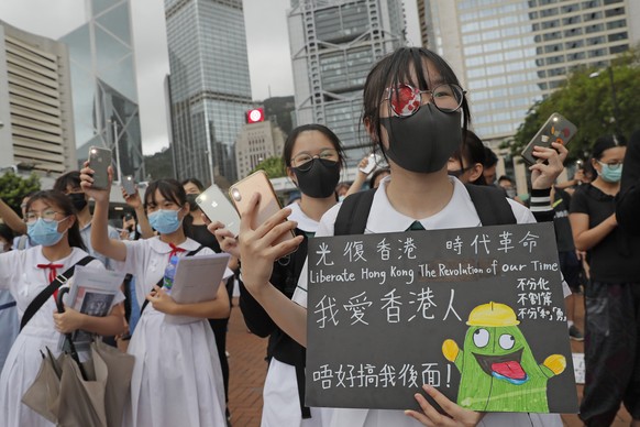 A student wears an eye patch to show solidarity with a woman injured by a police projectile during a previous protest, during a rally in Hong Kong, on Monday, Sept. 2, 2019. Hong Kong has been the sce ...
