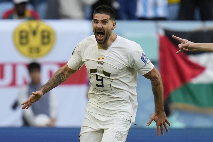 Serbia's Aleksandar Mitrovic celebrates after scoring his side's third goal during the World Cup group G soccer match between Cameroon and Serbia, at the Al Janoub Stadium in Al Wakrah, Qatar, Monday, ...