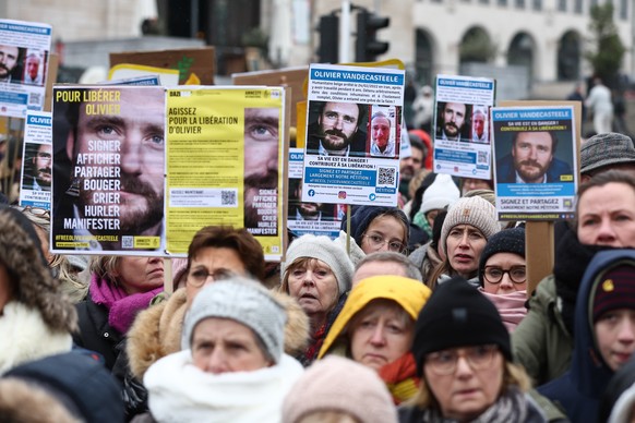 epa10422887 People gather to protest the detention of Belgian aid worker Olivier Vandecasteele in Iran, in Brussels, Belgium, January 22, 2023. Vandecasteele was detained in Iran on February 20…