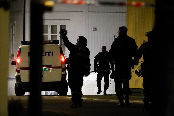 Police at the scene after an attack in Kongsberg, Norway, Wednesday, Oct. 13, 2021. Several people have been killed and others injured by a man armed with a bow and arrow in a town west of the Norwegi ...