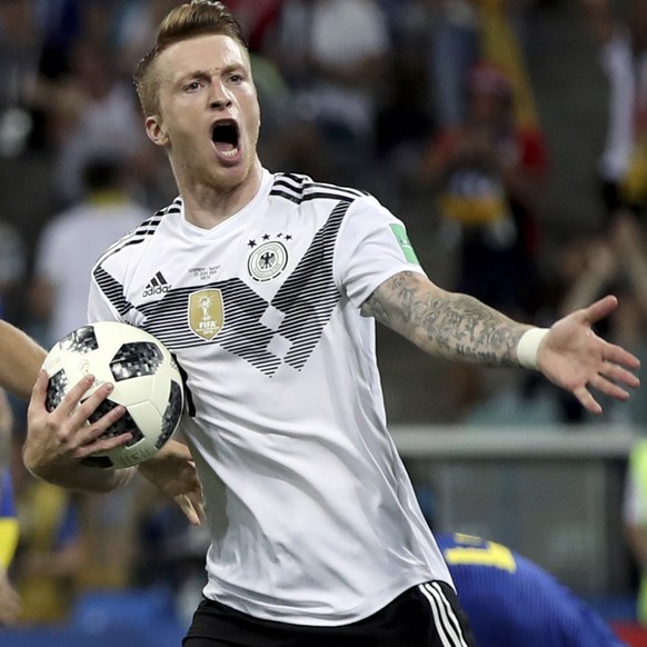 Germany&#039;s Marco Reus, right, celebrates with Thomas Mueller after scoring his side&#039;s opening goal during the group F match between Germany and Sweden at the 2018 soccer World Cup in the Fish ...