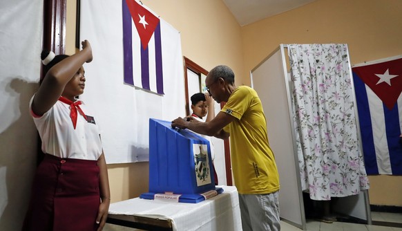 epa10544225 A man votes in the parliamentary elections, at a polling station in Havana, Cuba, 26 March 2023. Cubans go to the polls in parliamentary elections to elect members of the National Assembly ...