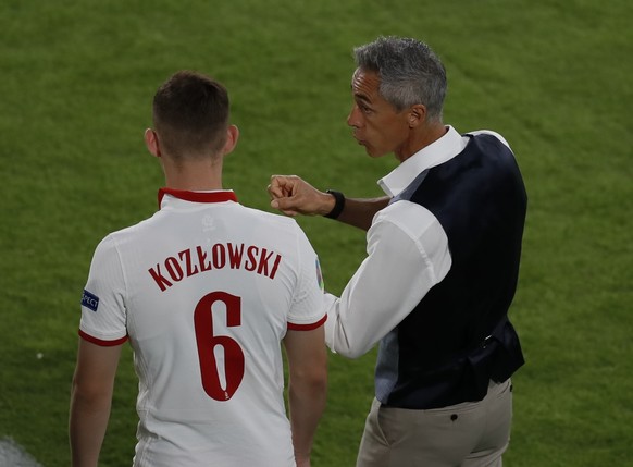 Poland&#039;s manager Paulo Sousa gives instructions to Poland&#039;s Kacper Kozlowski during the Euro 2020 soccer championship group E match between Spain and Poland at Estadio de la Cartuja stadium  ...